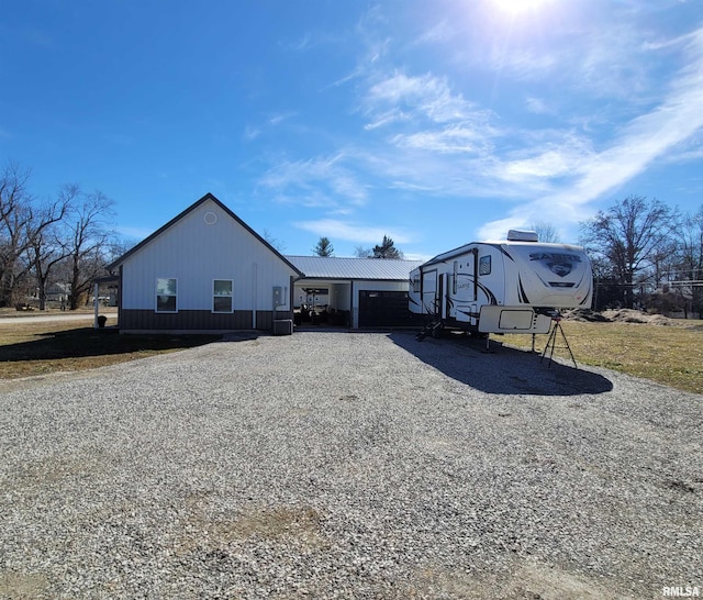 exterior space with gravel driveway