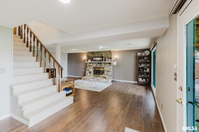 1437 Nassau Ln, Marion, IL 62959 - unfurnished living room featuring a fireplace, hardwood / wood-style floors, stairway, and baseboards
