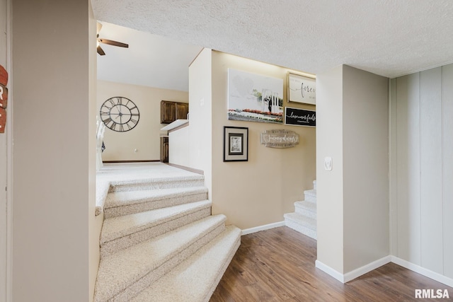 1437 Nassau Ln, Marion, IL 62959 - stairs featuring ceiling fan, wood finished floors, baseboards, and a textured ceiling