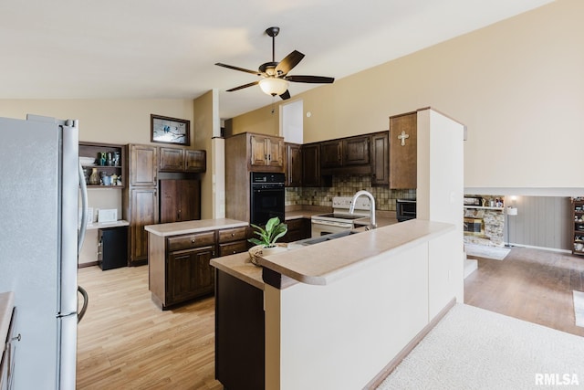 1437 Nassau Ln, Marion, IL 62959 - kitchen featuring freestanding refrigerator, a sink, ceiling fan, light wood-style flooring, and lofted ceiling