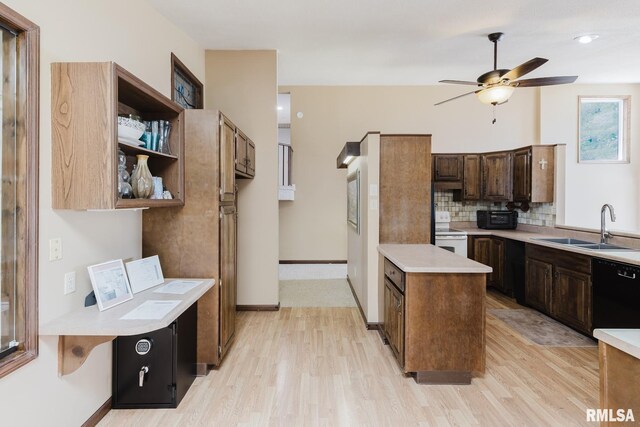 1437 Nassau Ln, Marion, IL 62959 - kitchen with black dishwasher, a sink, electric stove, a ceiling fan, and light countertops