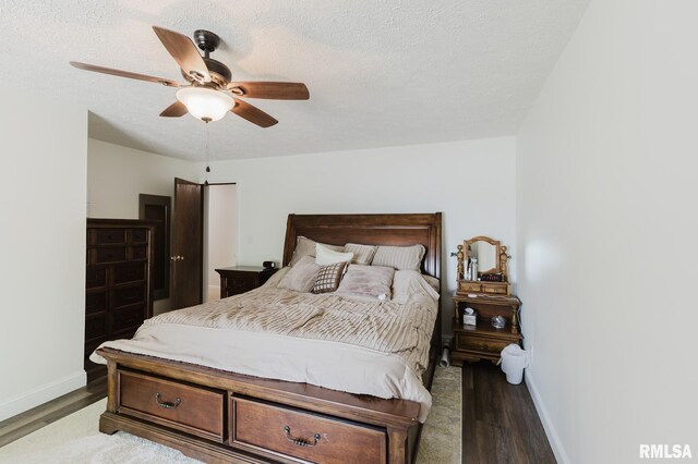 1437 Nassau Ln, Marion, IL 62959 - bedroom with wood finished floors, baseboards, ceiling fan, and a textured ceiling