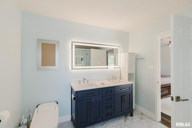 1437 Nassau Ln, Marion, IL 62959 - full bathroom with double vanity, toilet, marble look tile flooring, and baseboards