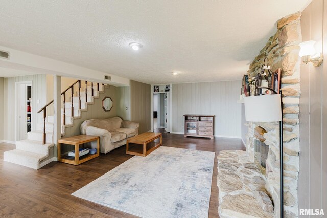 1437 Nassau Ln, Marion, IL 62959 - living room featuring stairs, dark wood-style floors, baseboards, and a textured ceiling