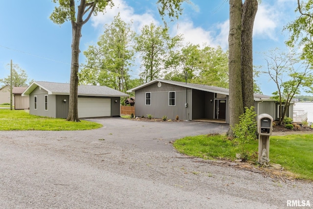 1437 Nassau Ln, Marion, IL 62959 - view of front of house with a detached garage, an outdoor structure, and a front yard