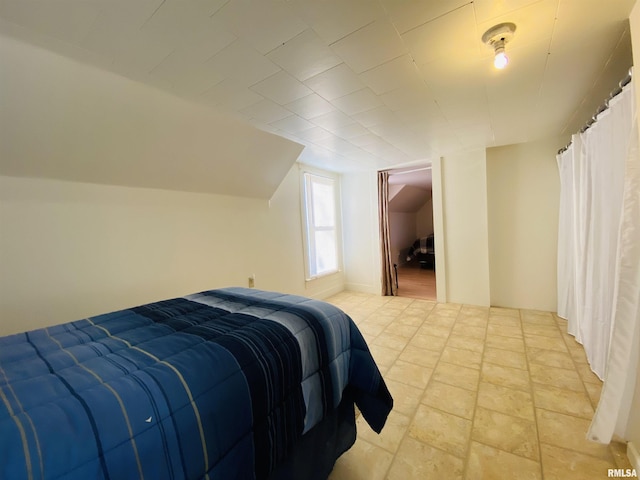 bedroom with vaulted ceiling