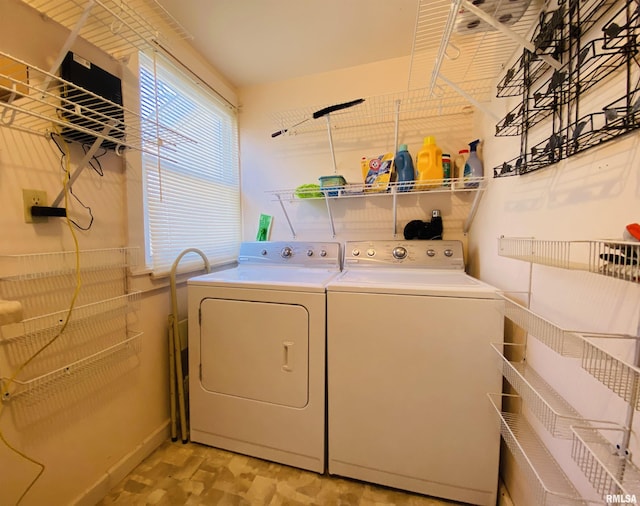 washroom featuring laundry area and washer and clothes dryer