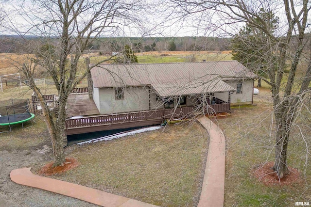 view of front facade with a trampoline and a deck