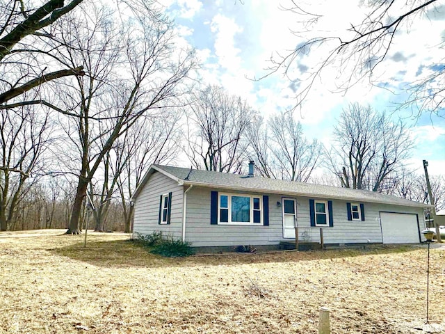 single story home with a garage