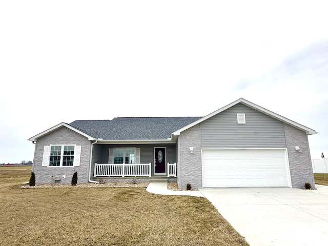 ranch-style home featuring a porch, a front yard, driveway, and a garage