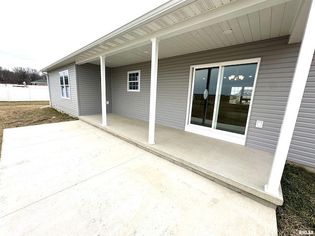 view of patio / terrace featuring fence