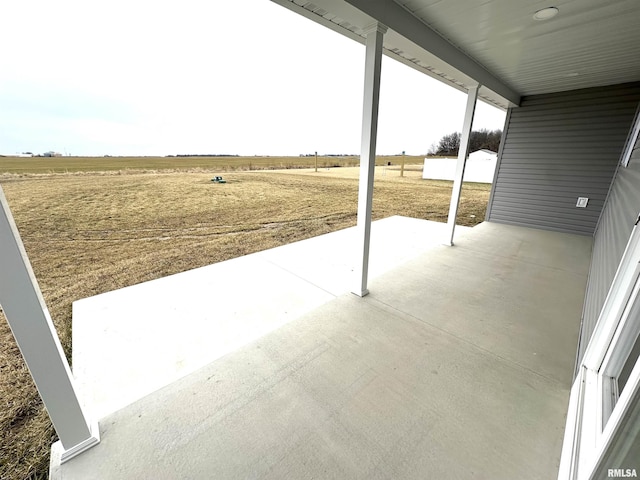 view of patio / terrace featuring a rural view