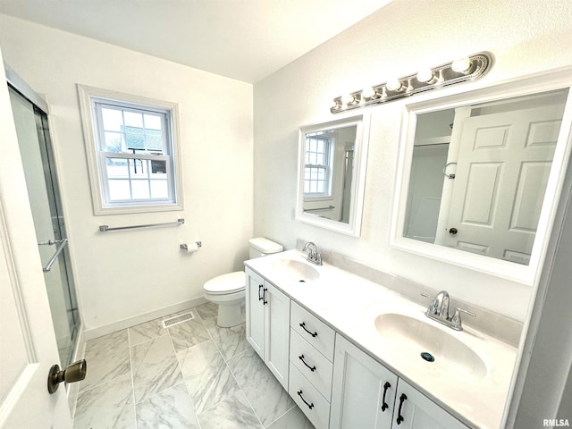 bathroom with marble finish floor, a sink, visible vents, and baseboards