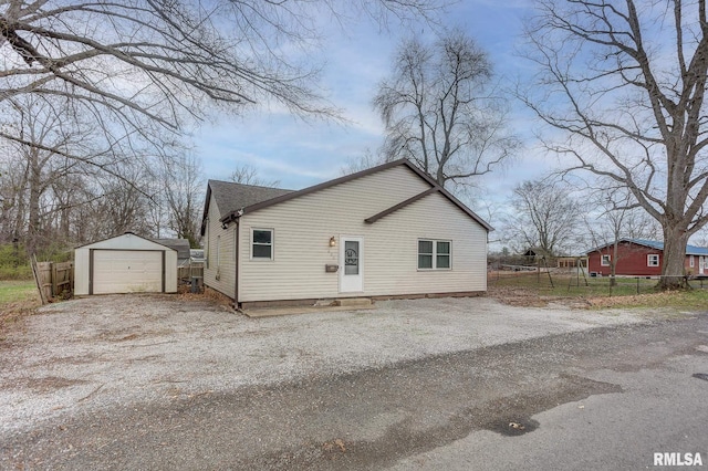 600 N Washington St, Sparta, IL 62286 - exterior space with an outbuilding, fence, a detached garage, and gravel driveway