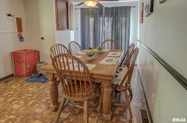 kitchen featuring brown cabinetry, light countertops, a sink, and white microwave