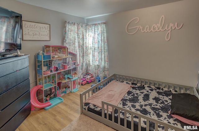 bedroom featuring wood finished floors