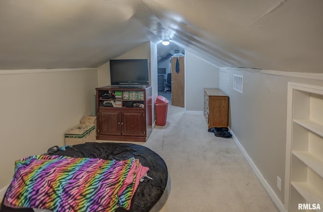 bedroom featuring lofted ceiling, baseboards, and light colored carpet