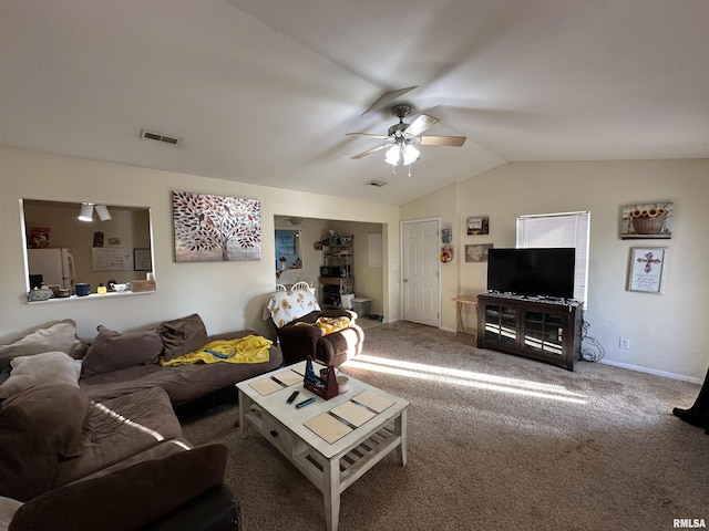 carpeted living room featuring vaulted ceiling, baseboards, visible vents, and a ceiling fan