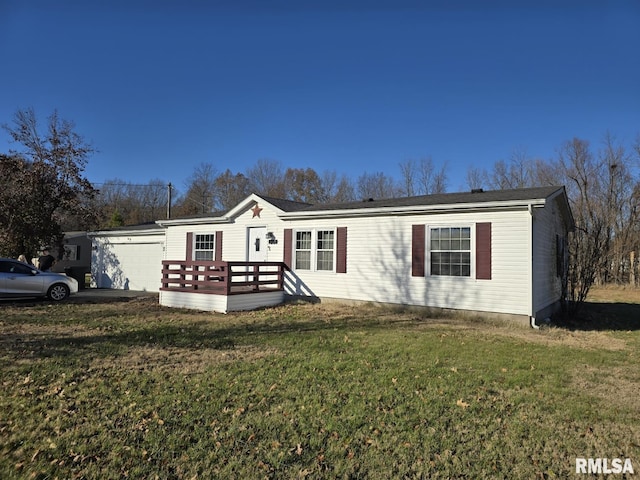 view of front of home with a front yard and a deck