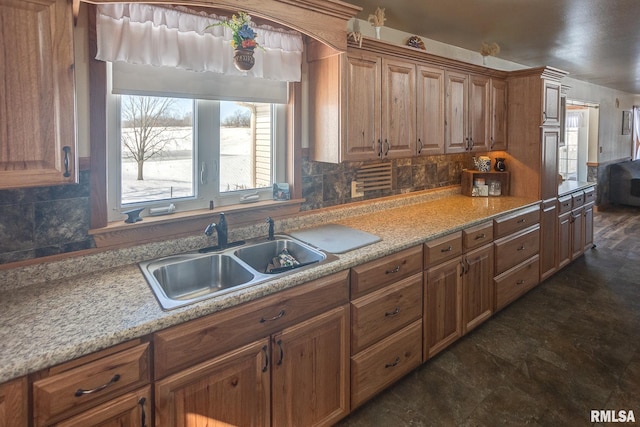1548 Koehn Rd, Ava, IL 62907 - kitchen featuring brown cabinets, stone finish flooring, a sink, and tasteful backsplash