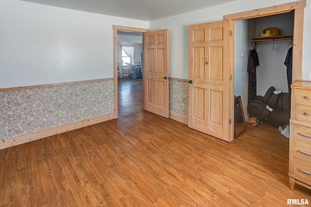 1548 Koehn Rd, Ava, IL 62907 - unfurnished bedroom with baseboards, light wood finished floors, and a wainscoted wall