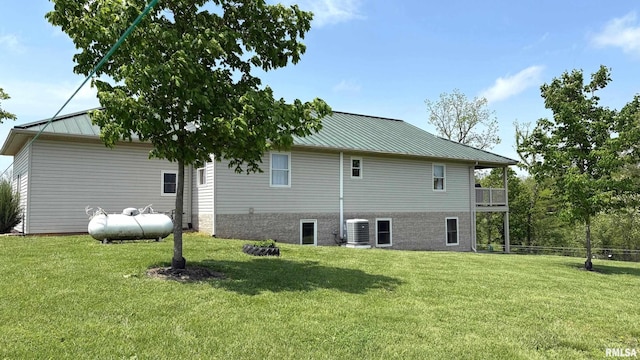 1548 Koehn Rd, Ava, IL 62907 - back of house featuring a lawn, a standing seam roof, cooling unit, and metal roof