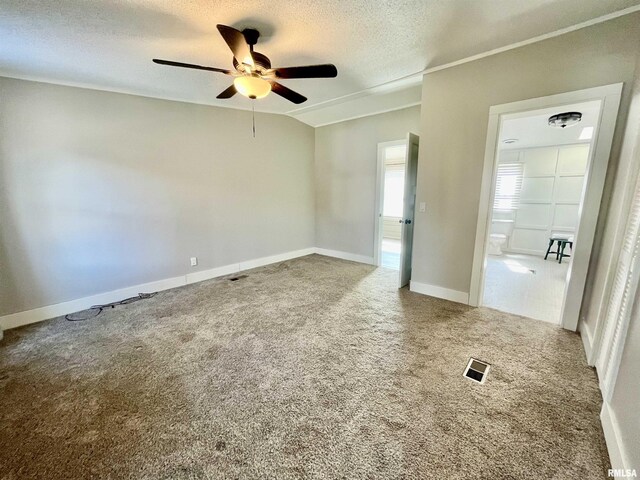 8065 E State Route 146th Hwy, Grantsburg, IL 62943 - empty room with a ceiling fan, a textured ceiling, carpet flooring, and baseboards