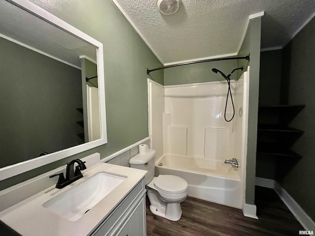 full bath with a textured ceiling, shower / bath combination, wood finished floors, vanity, and visible vents