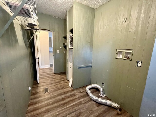 8065 E State Route 146th Hwy, Grantsburg, IL 62943 - laundry room featuring wood finished floors, hookup for an electric dryer, hookup for a washing machine, and a textured ceiling