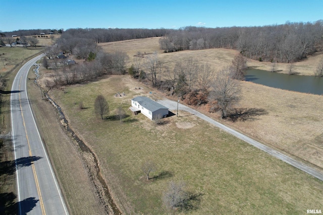 birds eye view of property featuring a water view and a rural view