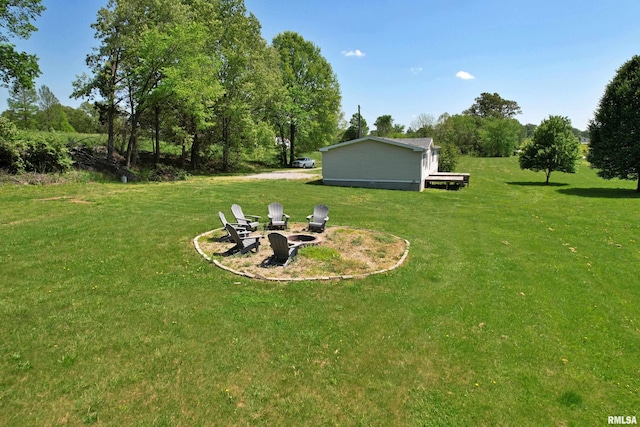 8065 E State Route 146th Hwy, Grantsburg, IL 62943 - view of green lawn featuring an outdoor fire pit