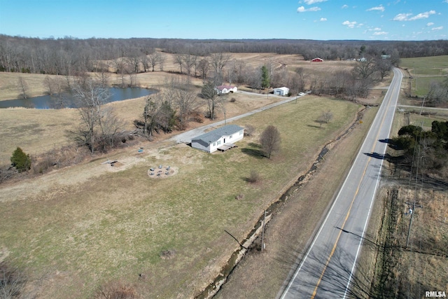 aerial view featuring a rural view and a water view