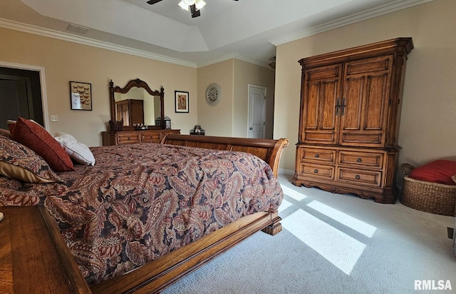 bedroom featuring ceiling fan, light carpet, visible vents, ornamental molding, and a raised ceiling