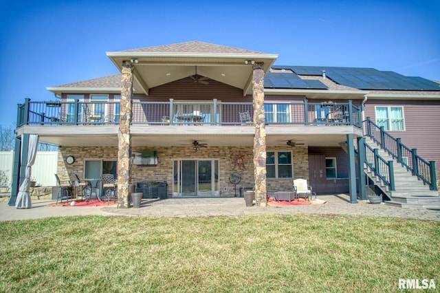 rear view of property with a patio area, ceiling fan, stairway, and a lawn