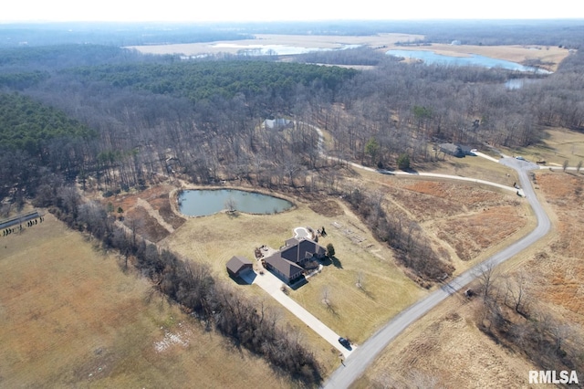 birds eye view of property featuring a rural view, a water view, and a wooded view