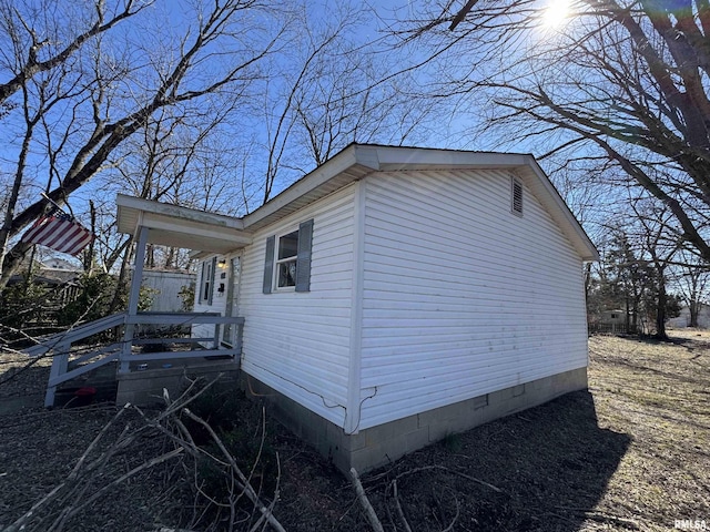 view of property exterior with crawl space