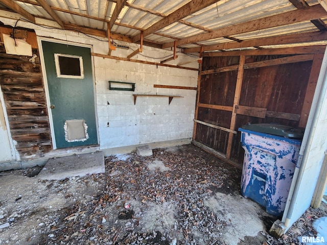 interior space with concrete block wall