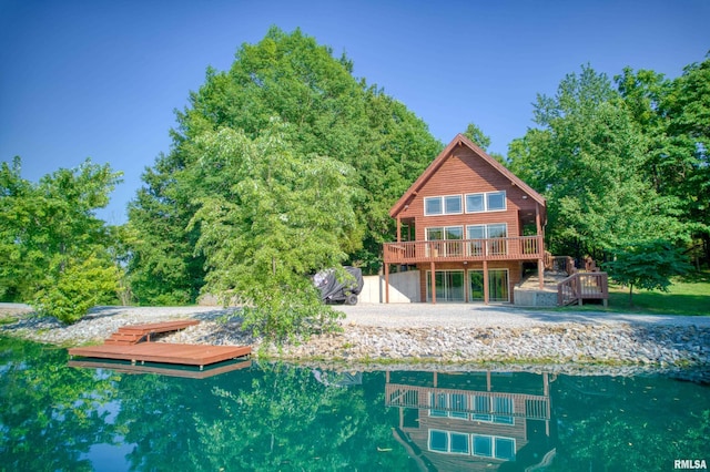 rear view of property with a wooden deck