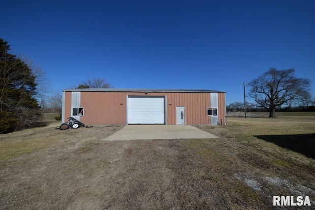 view of outbuilding featuring driveway and an outdoor structure