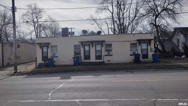 2207 Perkins St, Mount Vernon, IL 62864 - view of front of property with stucco siding and a chimney