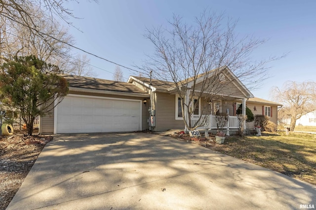 ranch-style home featuring a porch, driveway, and a garage