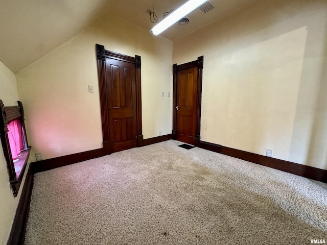 bonus room with carpet, visible vents, baseboards, and vaulted ceiling