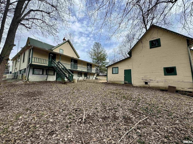 rear view of house with stairway