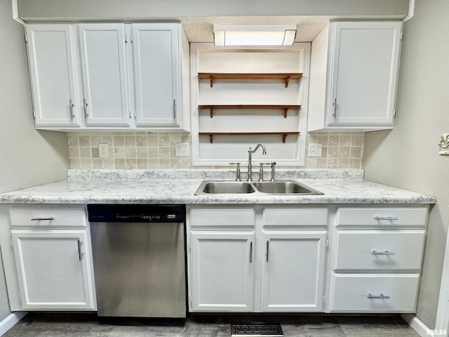 kitchen with dishwasher, open shelves, a sink, and white cabinets