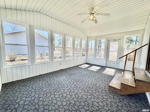 unfurnished sunroom with radiator, vaulted ceiling, and ceiling fan