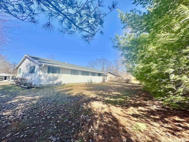 view of property exterior featuring crawl space