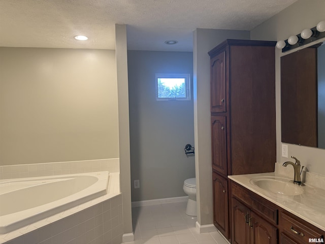 full bathroom with a textured ceiling, vanity, toilet, and a bath