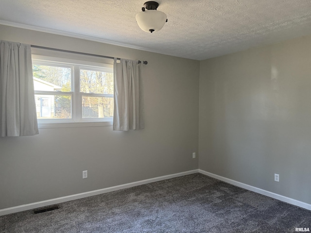 unfurnished room featuring a textured ceiling, dark carpet, visible vents, and baseboards