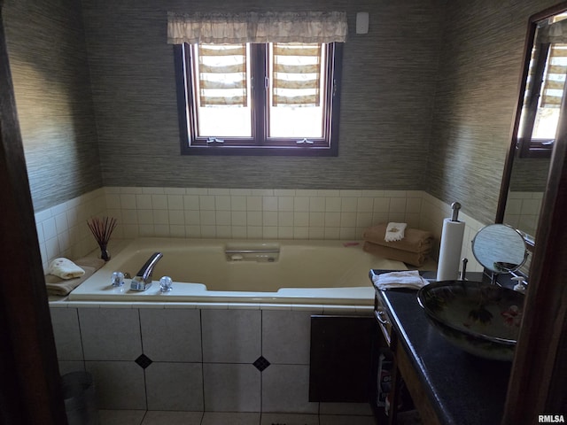 bathroom with plenty of natural light, vanity, and wallpapered walls