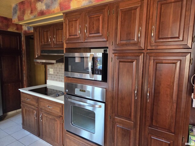 laundry area with dark wood-type flooring, cabinet space, visible vents, and separate washer and dryer